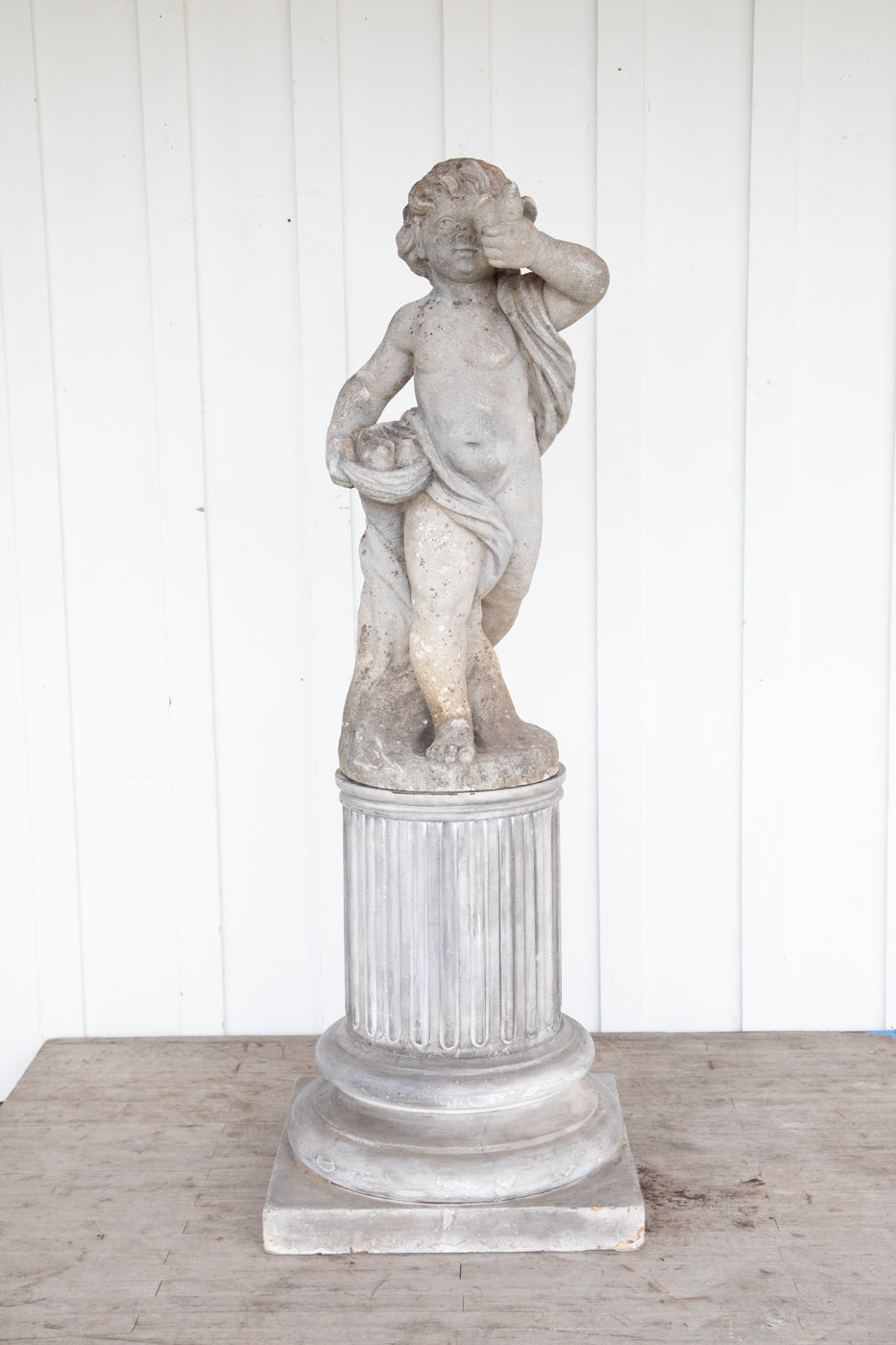 Concrete Cherub on wooden plinth